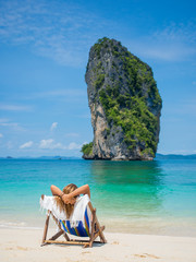 Fototapeta na wymiar woman relaxing on the beach in Thailand