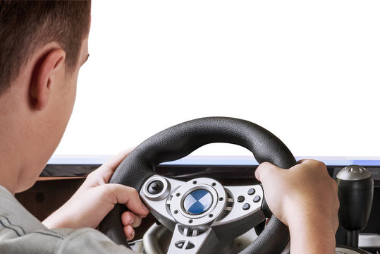 gamer playing in the race behind the wheel