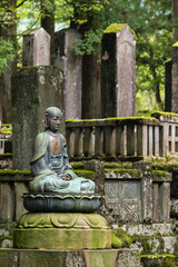 graveyard with sitting Buddha statue