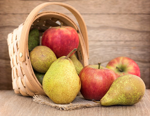 Pears and apples on wood table