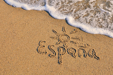 Fototapeta premium Spain sign on the sand beach