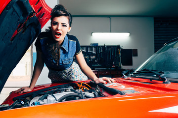 beautiful young woman surprised in car garage