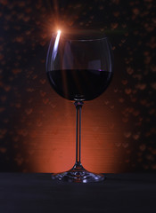 Glass of Red Wine with Lights Background