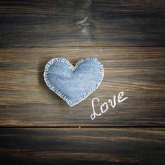 Jeans heart on wooden background