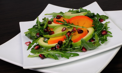 Salad with avocado, grapefruit, persimmon