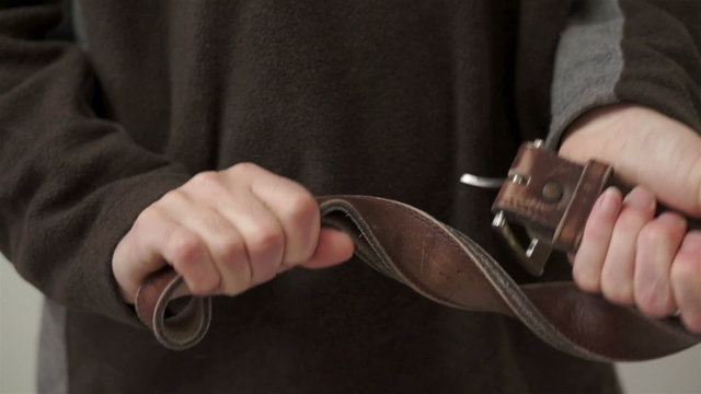 Angry Man With Belt in Hands