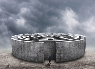 Man standing in front of the circular labyrinth
