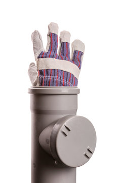 Building glove in soil-pipe on white