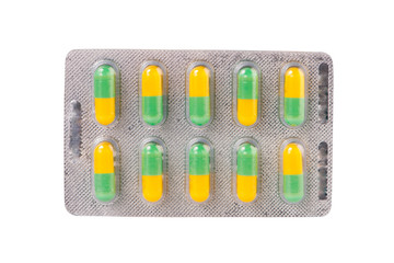 Green and yellow capsule in blister pack