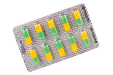 Green and yellow capsule in blister pack