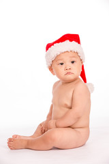 baby in santa cap on white background