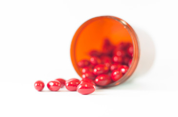 Red tablet and medicine brown bottle