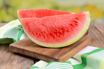 Juicy watermelon on table on bright background