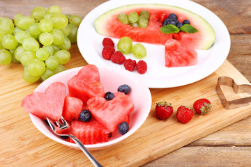 Fresh juicy watermelon slice  with cut out heart shape, filled