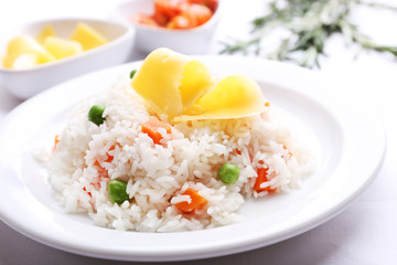 Vegetable rice served on table, close-up
