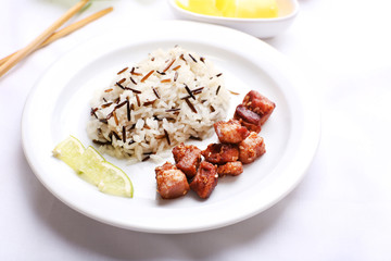 Tasty rice with meat served on table, close-up