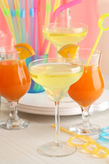 Glasses of fruit cocktails in party close-up