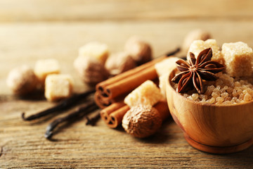 Christmas spices and baking ingredients on wooden background