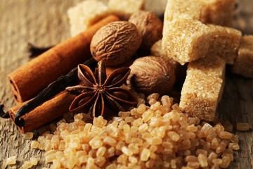Christmas spices and baking ingredients on wooden background
