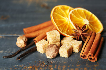 Christmas spices and baking ingredients on wooden background