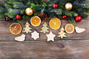 Fototapeta na wymiar gingerbread cookies with slices of orange and Christmas