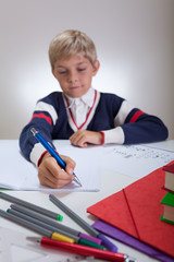 Child writing in notebook