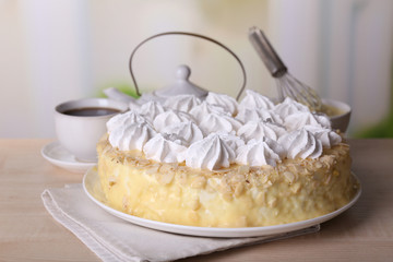 Tasty homemade meringue cake and cup of tea