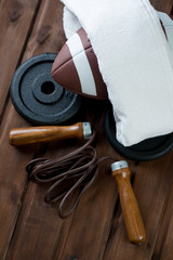 American football and various sports equipment, above view