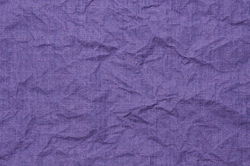 Violet crumpled paper as background