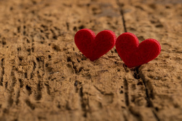 red hearts on a wooden surface