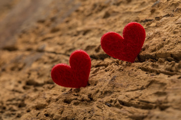 red hearts on a wooden surface