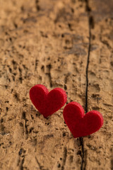 red hearts on a wooden surface