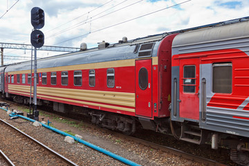Obraz premium View of the railway track and passenger train in Russia