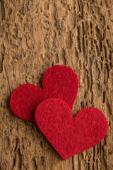 red hearts on a wooden surface