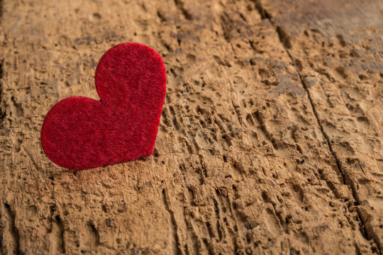 red heart on a wooden background