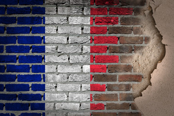 Dark brick wall with plaster - France