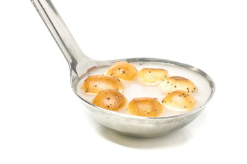Šližikai in the ladle isolated on the white background