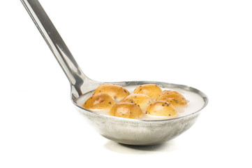 Šližikai in the big ladle isolated on the white background