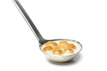 Kuciukai in the metal scoop isolated on the bright background