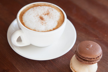Cappuccino cup with coffee beans