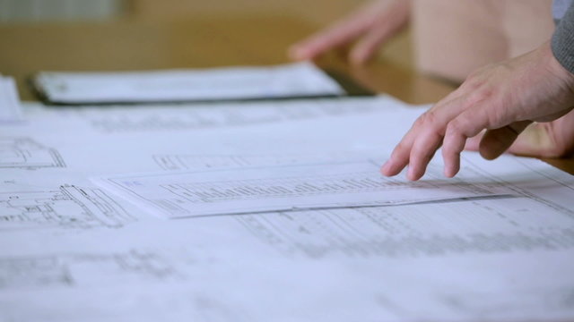 Review of documents and handshake closeup
