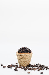 Mini clay pot with rattan rope and coffee seeds.