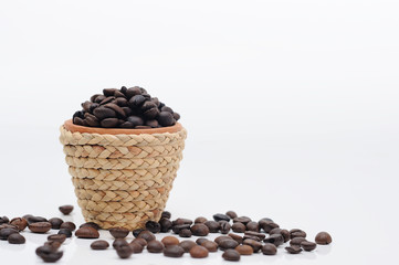 Mini clay pot with rattan rope and coffee seeds.