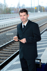 businessman on railroad station