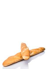 Fresh French baguette close up view over white background