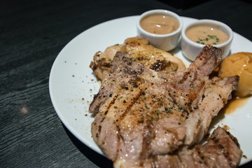 Pork chop and chicken with gravy