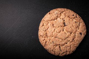 Oat cookies on the old shabby background. tinted. with space for