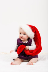 Child girl with Christmas santa hat
