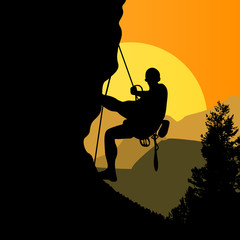 Climber on sunset background