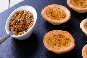 Small Pate tartlets with french mustard